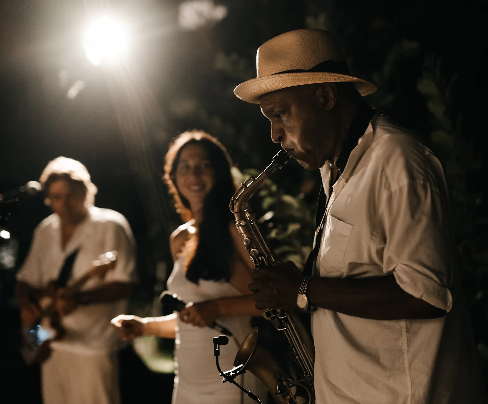 Saxophonist performing live during an evening celebration in Koh Samui
