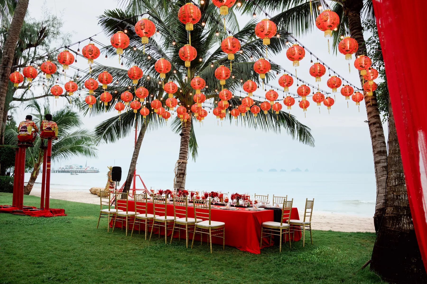 A red lantern celebration table set beside the sea